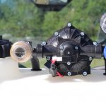 Inline strainer attached to an Everflo 12-volt pump on a Master Manufacturing spot sprayer