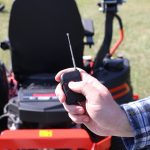 Using the power button on the wireless remote control with sprayer